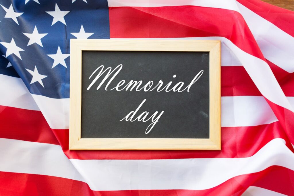 memorial day lessons from the military showing flag and soldiers honoring veterans