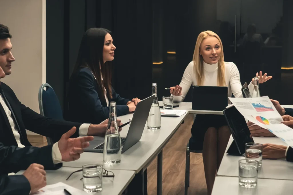 Executive team reviewing cyber risk in a boardroom advisory meeting