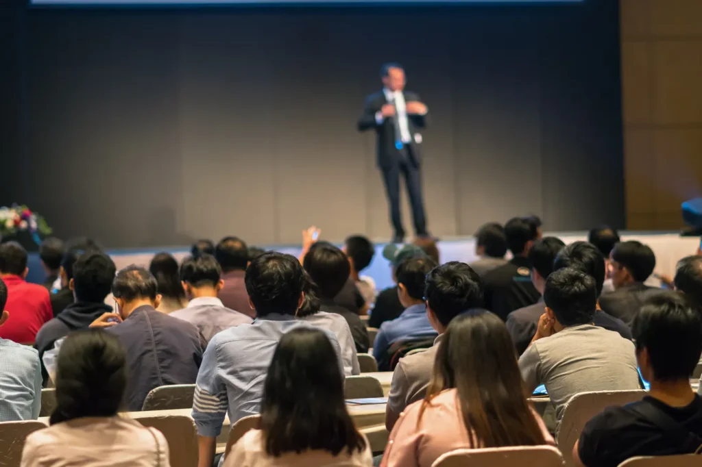 Cybersecurity keynote speaker presenting to a conference audience